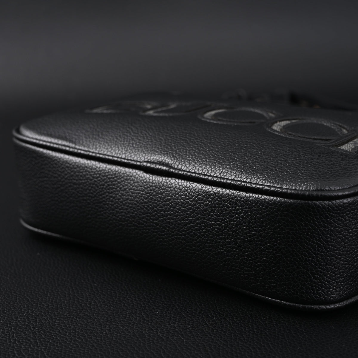 Gucci Black Leather Embossed Logo Belt Bag
