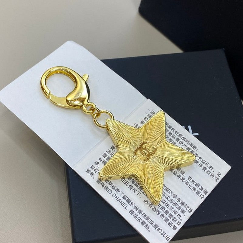Chanel Black Gold Star Brooch